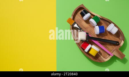 Plastic jars with multi-colored gouache, copy space Stock Photo