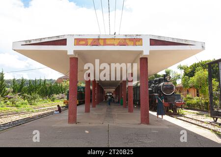 Da Lat city, Vietnam, September 21 2023 : Old retro steam railway train station on sunny day with local traveler Stock Photo