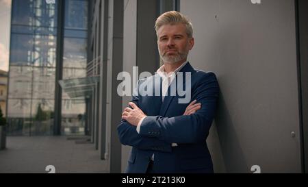 Caucasian middle-aged old man serious confident senior businessman mature retired business male employer 60s entrepreneur investor leader in city Stock Photo