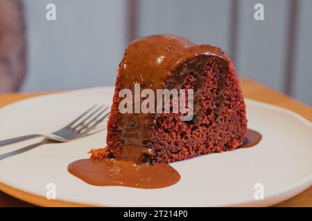 piece of chocolate cake with melted chocolate Stock Photo
