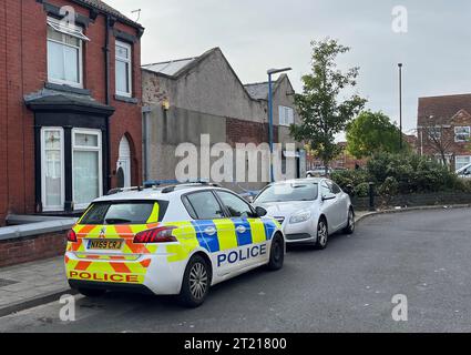A police cordon at Wharton Terrace, Hartlepool. Cleveland Police were called to a property in the street at 5.17am on Sunday and found an injured man who had suffered non-life-threatening injuries. A second man was found on nearby Tees Street, and he died at the scene. A 44-year-old has been arrested on suspicion of murder and attempted murder and he remains in custody. Issue date: Monday October 16, 2023. Stock Photo