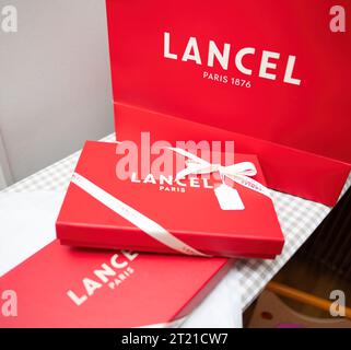 Paris, France - Aug 25, 2023: Multiple red luxury Lancel boxes ready for gifting Stock Photo