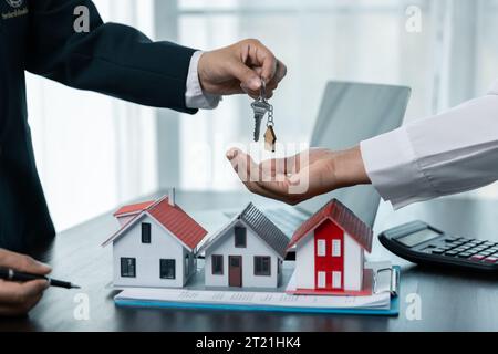 House sales representatives, sales representatives recommend housing details in the project to customers who are interested in viewing the houses in t Stock Photo