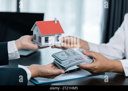 House sales representatives, sales representatives recommend housing details in the project to customers who are interested in viewing the houses in t Stock Photo