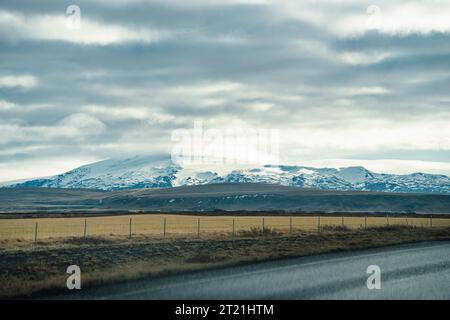 A scenic view of a paved road winding through a mountain landscape Stock Photo