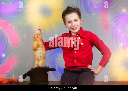 Colorful background of a magician boy worthy of a rabbit from a hat. Stock Photo