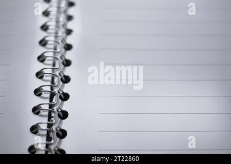 blank white papers in a line, open notepad on a spiral. Stock Photo
