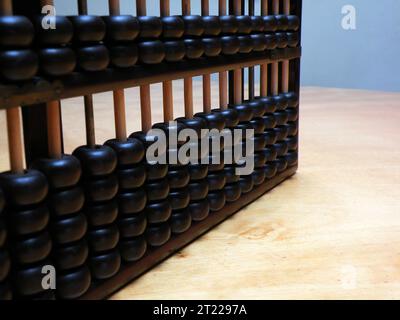 Chinese abacus on wooden table Stock Photo