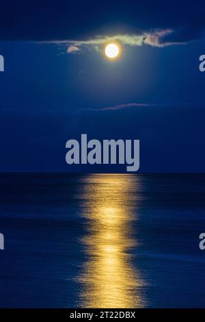 The super moon on 29/8/2023 rising over the sea off the Kintyre Peninsula, Scotland UK Stock Photo