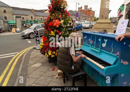 Carrick-on-Shannon, Leitrim Ireland July 12 2018 - A man playing a blue piano in the street in Carrick on Shannon Stock Photo