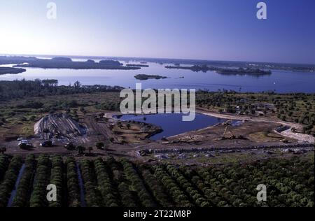 Converting recently purchased orange groves into productive wildlife habitat for the birds of Pelican Island. Looking south toward Pelican Island from the barrier island. Subjects: Aerial photography; Habitat restoration; Wildlife refuges. Location: Florida. Fish and Wildlife Service Site: PELICAN ISLAND NATIONAL WILDLIFE REFUGE. Stock Photo