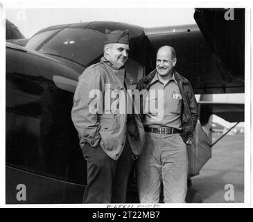 This photo was taken in 1950 on Amchitka Island, Alaska. 'L-R: Captain Floyd A. Puckett, C.O. of Air Force Base on Amchitka Island and John Ball, chief of Aircraft Operations for FWS.'. Subjects: Wildlife refuges; Alaska Maritime National Wildlife Refuge; Aleutians; Aircraft; Work of Service; Personnel; ARLIS; Alaska.  . 1998 - 2011. Stock Photo