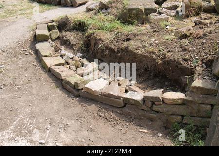 The Foundations of a Traditional Rural Dry Stone Wall. Stock Photo