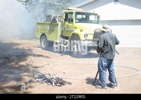 Wildfire Structure Protection Engine Filming a fire education video, demonstrating safety procedures and ...