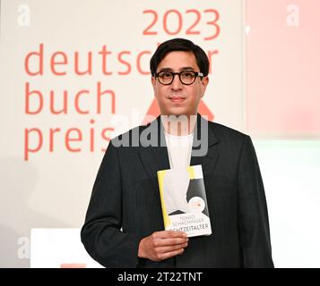 16 October 2023, Hesse, Frankfurt/Main: Austrian author Tonio Schachinger receives the German Book Prize 2023 award for his novel 'Endzeitalter. The prize for the best German-language novel of the year is awarded annually at the start of the Frankfurt Book Fair. Photo: Arne Dedert/dpa Stock Photo