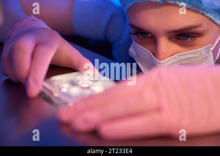 Experienced female researcher preparing samples for storage Stock Photo