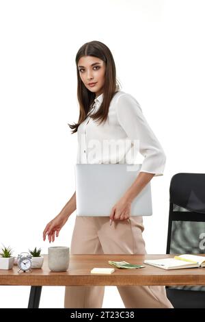 Young beautiful woman holding laptop computer. Businesswoman Stock Photo