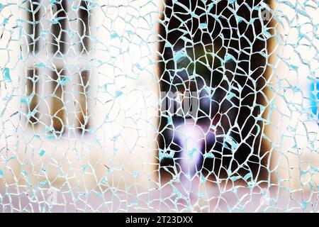 Close up shattered broken security glass surface texture Stock Photo