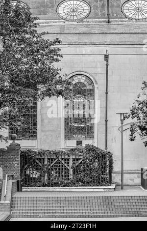 Church of Saint Magnus-the-Martyr winders with Monument to the Great Fire of London in the background Stock Photo