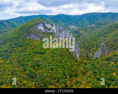 An aerial view of the Seneca Rocks with lush vegetation and clouds Stock Photo