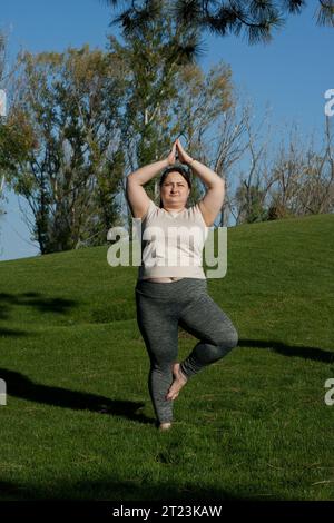 Overweight Woman Doing Fitness Exercises On A Sports Mat During Her 