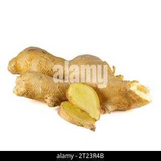 Fresh ginger rhizome with sliced isolated on white background.  Stock Photo