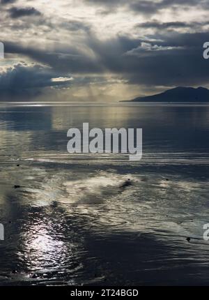 Stormy clouds forming over calm water in Icy Straight near Gustavus Alaska. Stock Photo