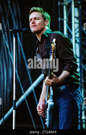 BRYAN ADAMS, CARDIFF, 2002: Bryan Adams playing an open air concert live at Cooper's Field in Cardiff, Wales, UK on 21 July 2002. The Canadian rocker was touring with his Spirit: Stallion of the Cimarron album. Photo: Rob Watkins Stock Photo