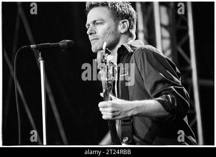 BRYAN ADAMS, CARDIFF, 2002: Bryan Adams playing an open air concert live at Cooper's Field in Cardiff, Wales, UK on 21 July 2002. The Canadian rocker was touring with his Spirit: Stallion of the Cimarron album. Photo: Rob Watkins Stock Photo