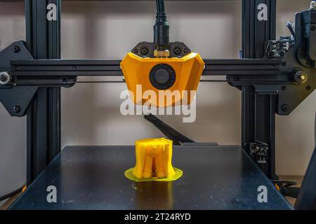 Printed on a 3D printer with yellow filament. Stock Photo
