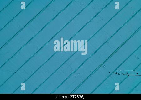 Fragment of a wooden gate painted blue. Stock Photo