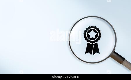 Certification, Quality warranty concept. Standardization, ISO. magnifier and quality warranty icon on blue background. banner and advertising premium Stock Photo