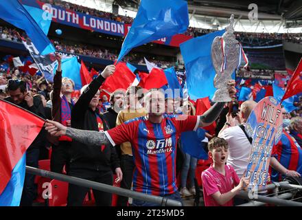 Crystal Palace fans holding aloft a home made FA Cup Trophy and