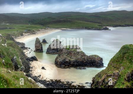 Garry Beach is a beautiful white sand beach with spectacular sea stacks and caves on the Isle of Lewis in the Outer Hebrides of Scotland. Stock Photo