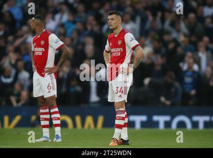 Granit Xhaka & Gabriel of Arsenal looks disappointed & dejected after Arsenal go 2-0 behind against Tottenham Hotspur. - Tottenham Hotspur v Arsenal, Premier League, Tottenham Hotspur Stadium, London, UK - 12th May 2022 Editorial Use Only - DataCo restrictions apply Stock Photo