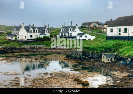 Scalpay Village is the main settlement on the Isle of Scalpay, which is a small island located just off the coast of the Isle of Harris in the Outer H Stock Photo