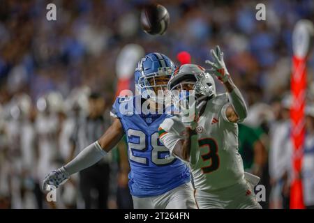 Chapel Hill, NC USA: Miami Hurricanes wide receiver Jacolby George (3) looks up at the ball to make a reception while closely covered by North Carolin Stock Photo