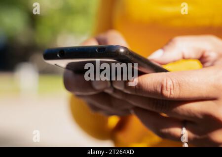 Close-up image of a young woman's hands using a smartphone Stock Photo