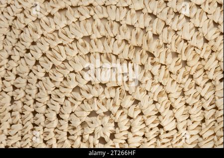 Round mesh beige sennit background close up view Stock Photo