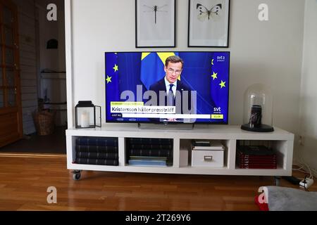 Someone in a Swedish home following Tuesday's press conference with Sweden's Prime Minister Ulf Kristersson on the occasion of yesterday's terrorist attack in Brussels, Belgium, when two Swedish people were shot dead. According to information, the persons were wearing Swedish football shirts due to the international match between Belgium and Sweden. Stock Photo