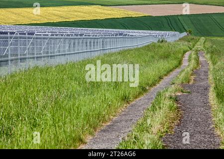 agricultural landscape with a solar farm, near Uslar, district of Northeim, Weser Uplands, southern Lower Saxony, Germany, Europe Stock Photo