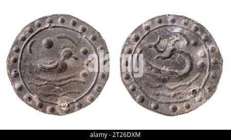 An ancient means of payment from Funan with the image of a duck and a shilby catfish.. Isolated on white Stock Photo