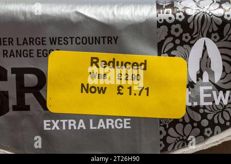 Yellow reduced sticker on box of St Ewe free range eggs Grand rather large Westcountry free range eggs - price reduction, price mark down Stock Photo