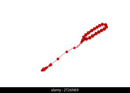 Red Tespih with white background. Stock Photo
