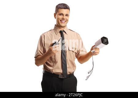 Young security guard holding a walkie talkie and a surveillance camera isolated on white background Stock Photo