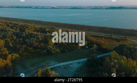 Aerial view over Danube river near Bratislava, Slovakia. The Photography was shoot from a drone at a higher altitude above the river in the morning. Stock Photo