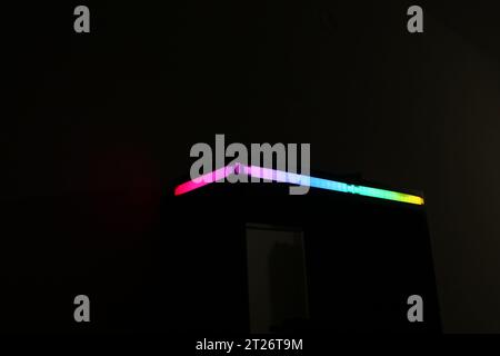 LED strip light diffused with paper that displays gradient colors on a house object. LED light decor applications Stock Photo
