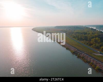 Aerial view over Danube river near Bratislava, Slovakia. The Photography was shoot from a drone at a higher altitude above the river in the morning. Stock Photo