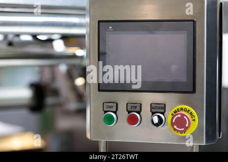 Control console of automated packaging machine at food production factory. Selective focus. Stock Photo