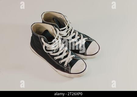 black sneakers closeup in white background Stock Photo